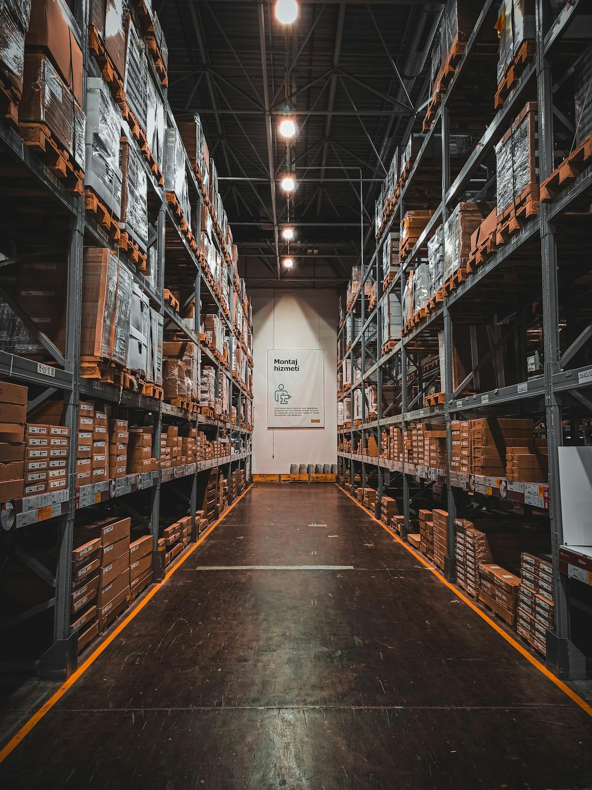 Organized warehouse aisle with stacks
